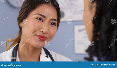 Close Up Of Japanese Physician Looking At Patient Stock Image Image