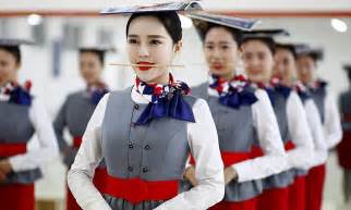 Chinese Flight Attendants Practise Graceful Grin With A