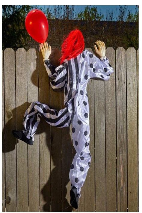 life size climbing creepy  pennywise clown outdoor