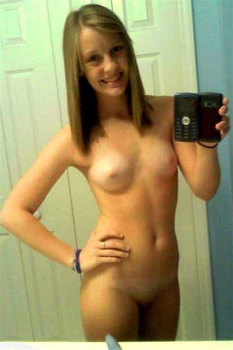 cute blonde smiling for her first nude selfie