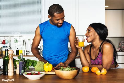 download premium image of black couple cooking healthy food in the