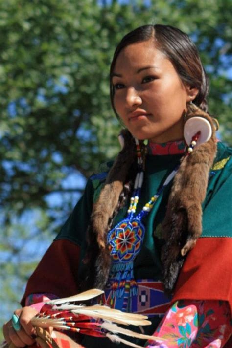 A Native American Woman In Traditional Clothing
