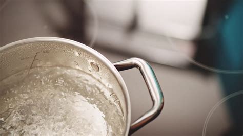 slow motion pan over boiling water in kitchen stock video footage 00 18