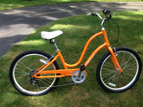 bikes    electra townie  step  womens bike orange pearl