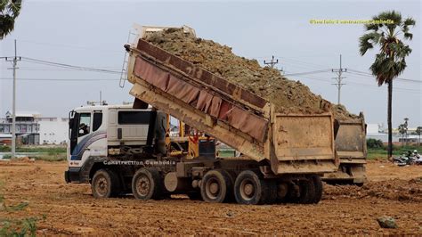 dump trucks dumping  load  dirt  bulldozer pushing dirt youtube