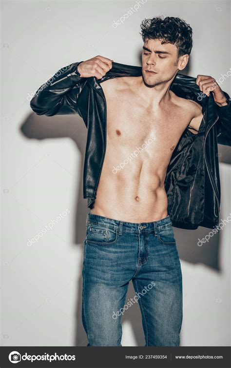 Sexy Man Posing Jeans Wearing Black Leather Jacket Grey