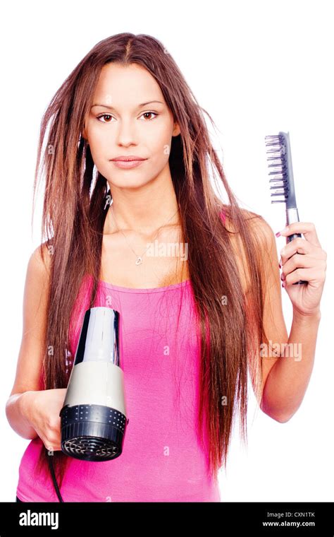 Woman With Long Hair Holding Blow Dryer And Comb Isolated On White