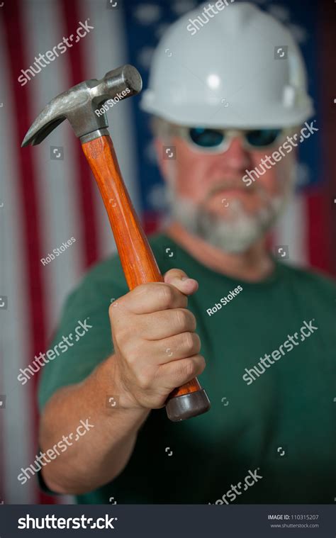 construction worker holding a hammer with the american