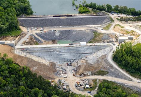 berm construction completes  repair phase  dam rehabilitation