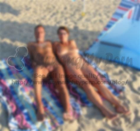 older couple on a beach posing nude with woman s big hairy cunt and small flabby tits and man s