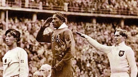 jesse owens receiving his gold medal in the 1936 olympics