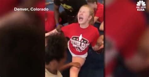 videos show high school cheerleaders forced into splits