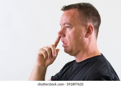 unintelligent man picking  nose stock photo  shutterstock