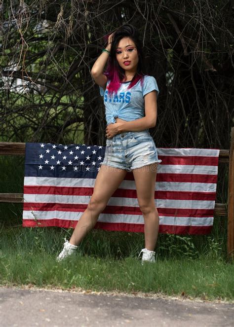 Beautiful Asian Girl Posing In The American Independence Day Stock