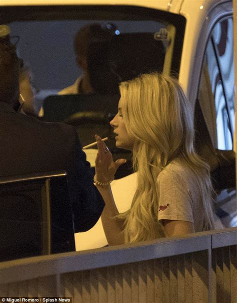 lottie moss enjoys cigarette at malaga airport daily