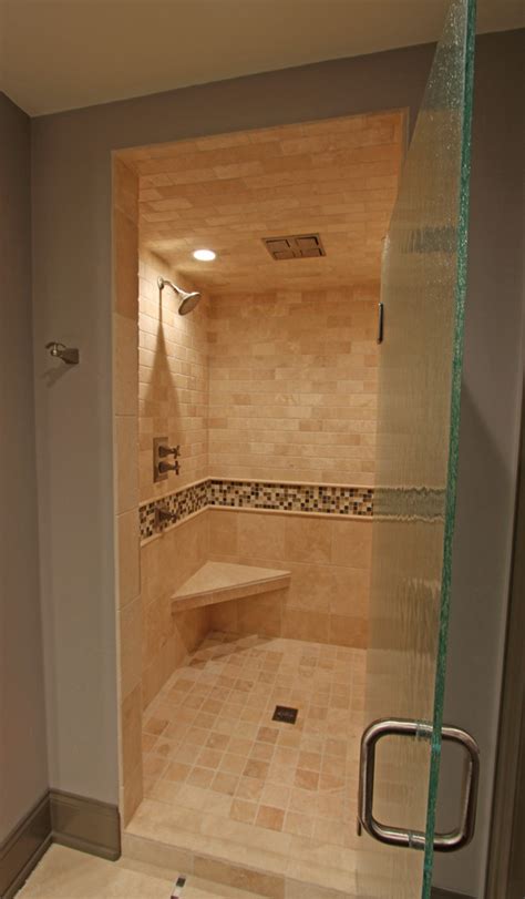 Custom Tile Shower With Corner Tile Bench And Textured Glass Door