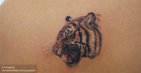 Tiger Head Tattoo On The Left Shoulder Blade