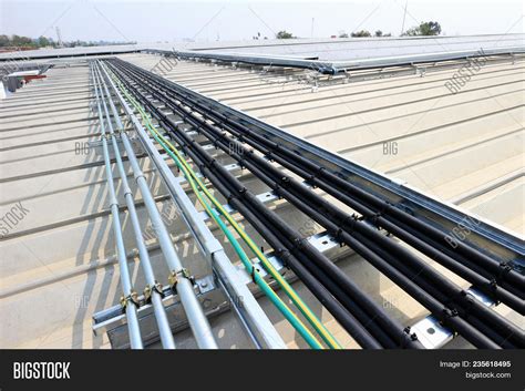 cable installation  solar rooftop system  metal sheet roof image stock photo