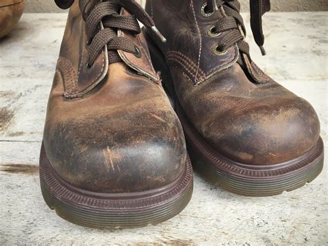 rare dr martens boots  stitching uk size   women size  brown leather  eyelet combat