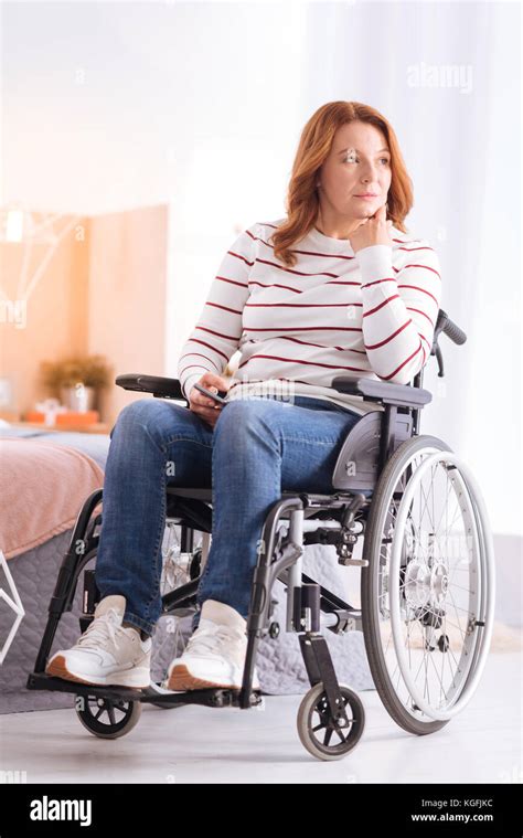crippled woman thinking   wheelchair stock photo alamy