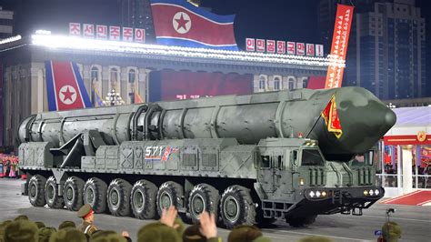 north korea urges preparedness  war  displays  missile