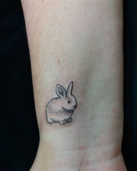 miniature rabbit on wrist by juliana ribas rabbit tattoos white