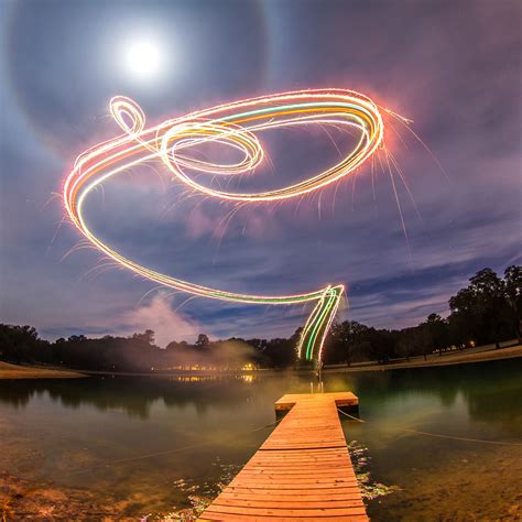 photographer creates colorful long exposure photographs  attaching fireworks   drone
