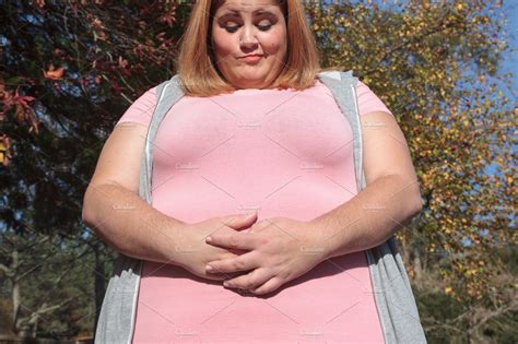 worried overweight woman featuring belly fat exercise and fat