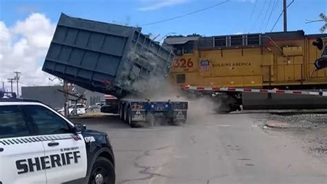 train hit  truck toss  lbs  cargo   feather