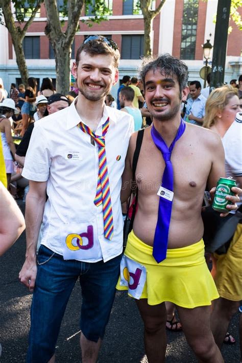 people participating at the gay pride parade in madrid editorial stock