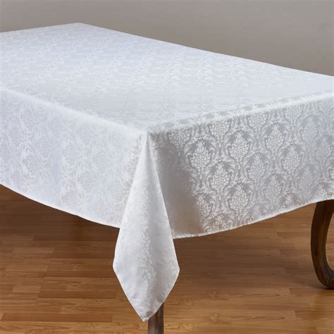 saro lifestyle white polyester tablecloth  subtle damask pattern