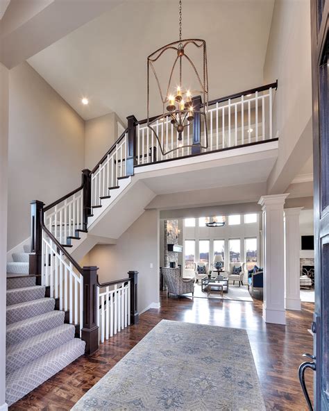 entry curved staircase open floor plan overlook   upper level curved staircase