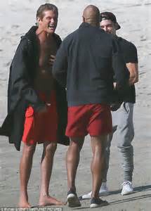 david hasselhoff wears famous red shorts alongside the rock on baywatch set daily mail online