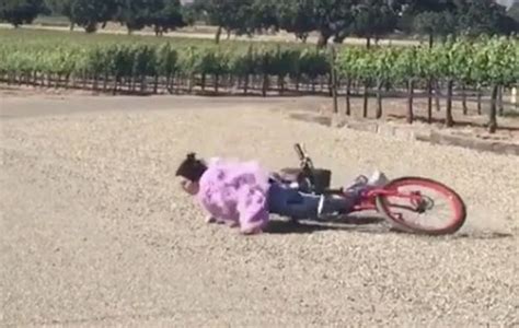 kendall jenner takes a tumble off her bike and face plants the floor as sister khloe kardashian