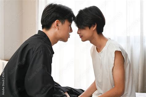 Two Handsome Young Asian Gay Men Face To Face Showing Some Affection