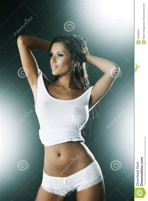 wet woman wearing white tank top and panties stock images