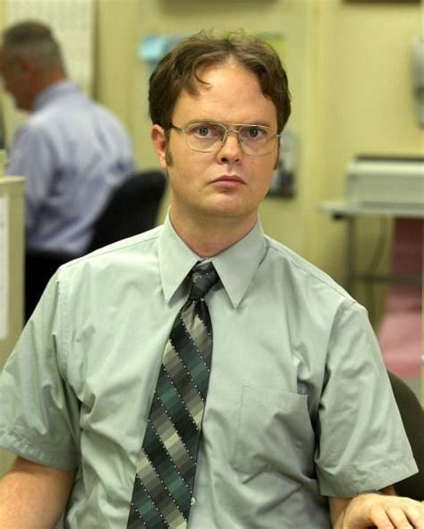 man wearing glasses   tie sitting   office