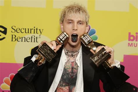 Here’s Why Machine Gun Kelly Painted His Tongue Black For 2021