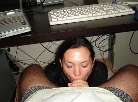 lovely wife sucks fully husbands cock under the desk hot photo