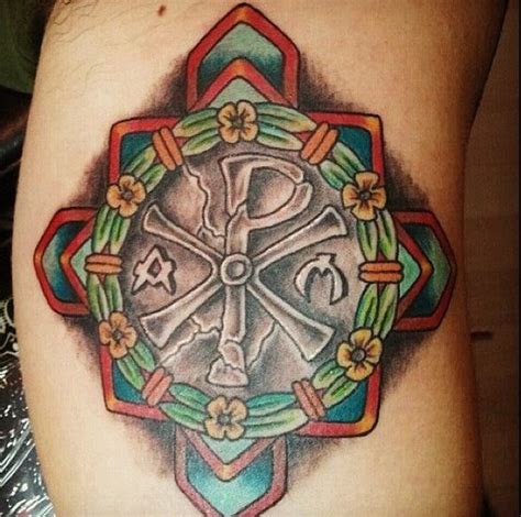 big detailed colorful cross tattoo  arm stylized  flowers  chirho tattooimagesbiz