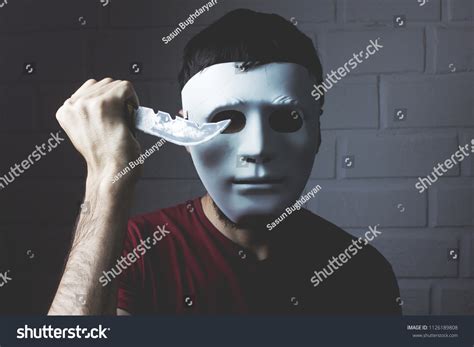 man  white mask white man  lifelike black mask  evade arrest  robberies