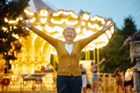 Premium Photo Pretty Granny Poses In Summer Amusement Park Bright