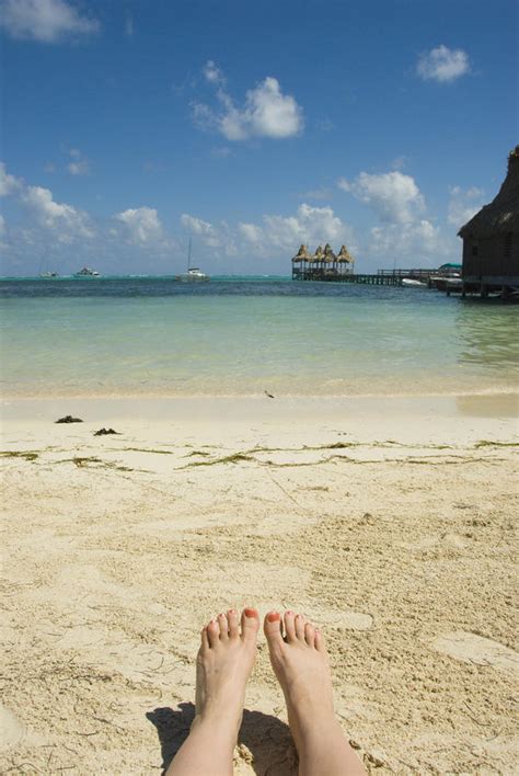 Womens Feet On The Beach With A View Photograph By James Forte