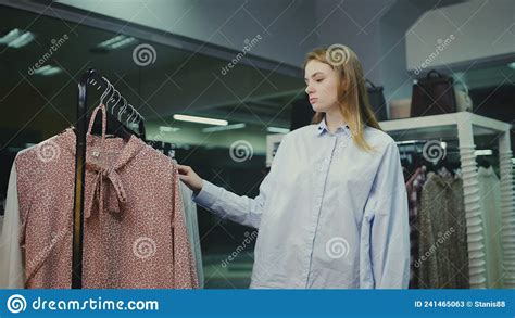 A Cute Girl Chooses Clothes In A Store Shopping Stock Image Image Of