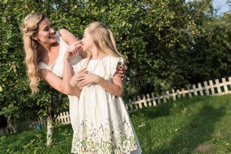 Blonde Mom And Daughter In White Dresses Having Fun Stock Image Image