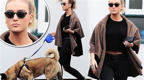 perrie edwards is alone again as she cuts a solemn figure back in
