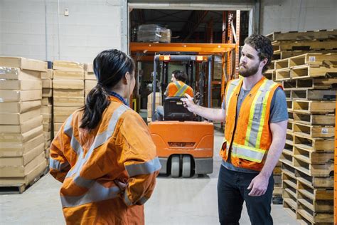 industrial warehouse workplace safety topic  manager discusses  issue   forklift