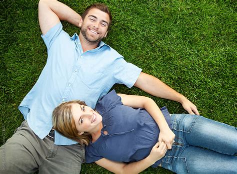 Grass Young Couple Laying Together On Grass By Sean Locke Grass
