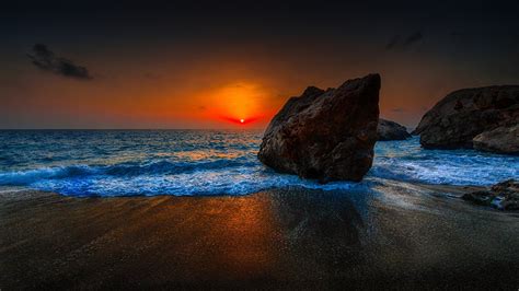 Sky Clouds Sunset Sun Glow Sea Rock Stones Beach Hd Wallpaper