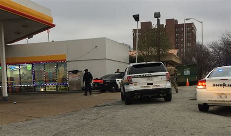 police say clerk fired shots during gas station shooting